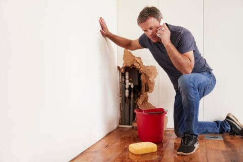 Burst Pipes Plumbing Emergency Man On Phone Ly